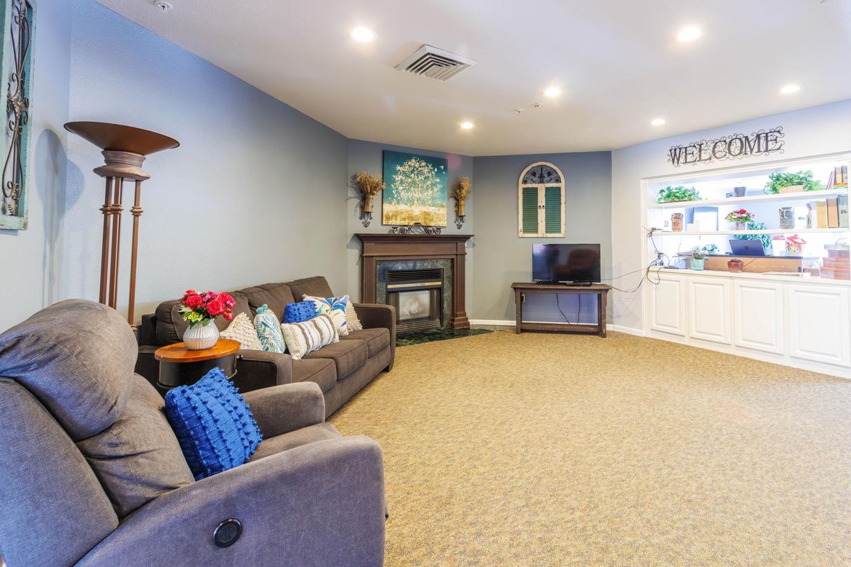 Cozy living room with a fireplace and comfortable seating.