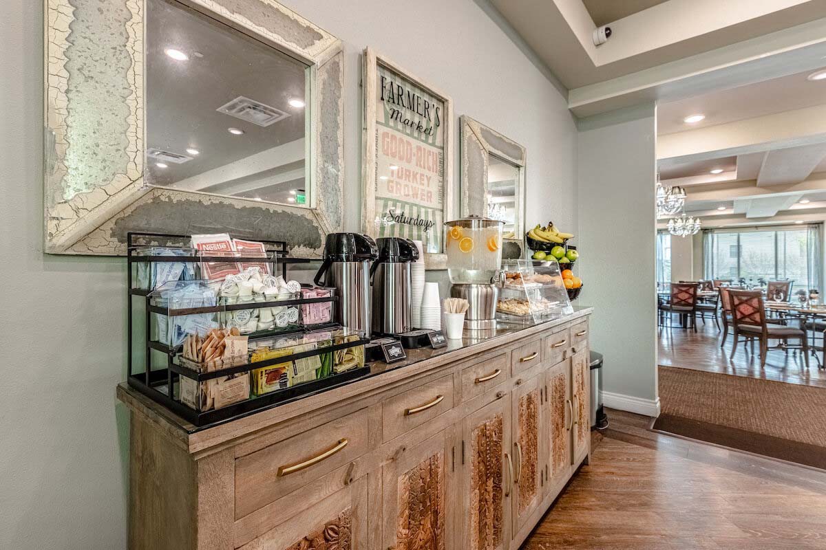 A rustic coffee and snack station in a cozy indoor setting.