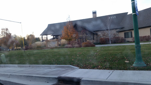 A beautiful stone house surrounded by well-maintained landscaping.