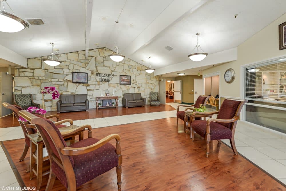 A spacious lobby with comfortable seating and warm lighting.