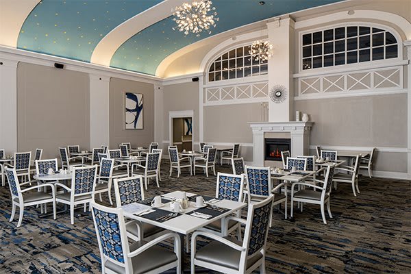 Elegant dining area with a decorative ceiling and chandelier.