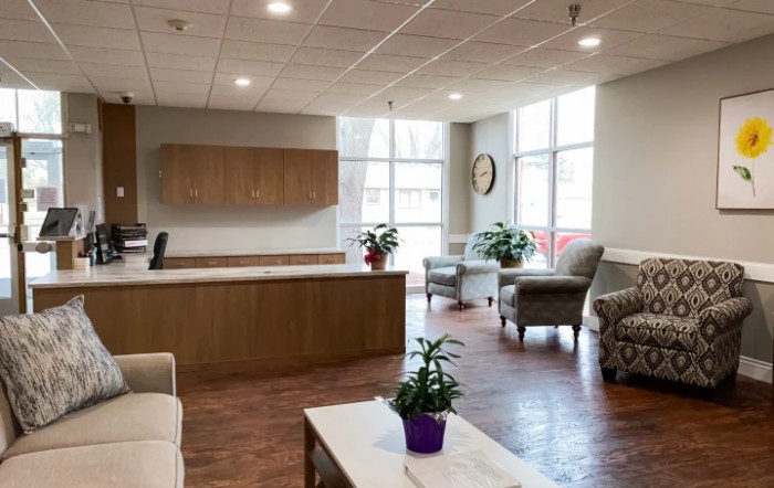 A modern and welcoming waiting room with comfortable seating and natural light.