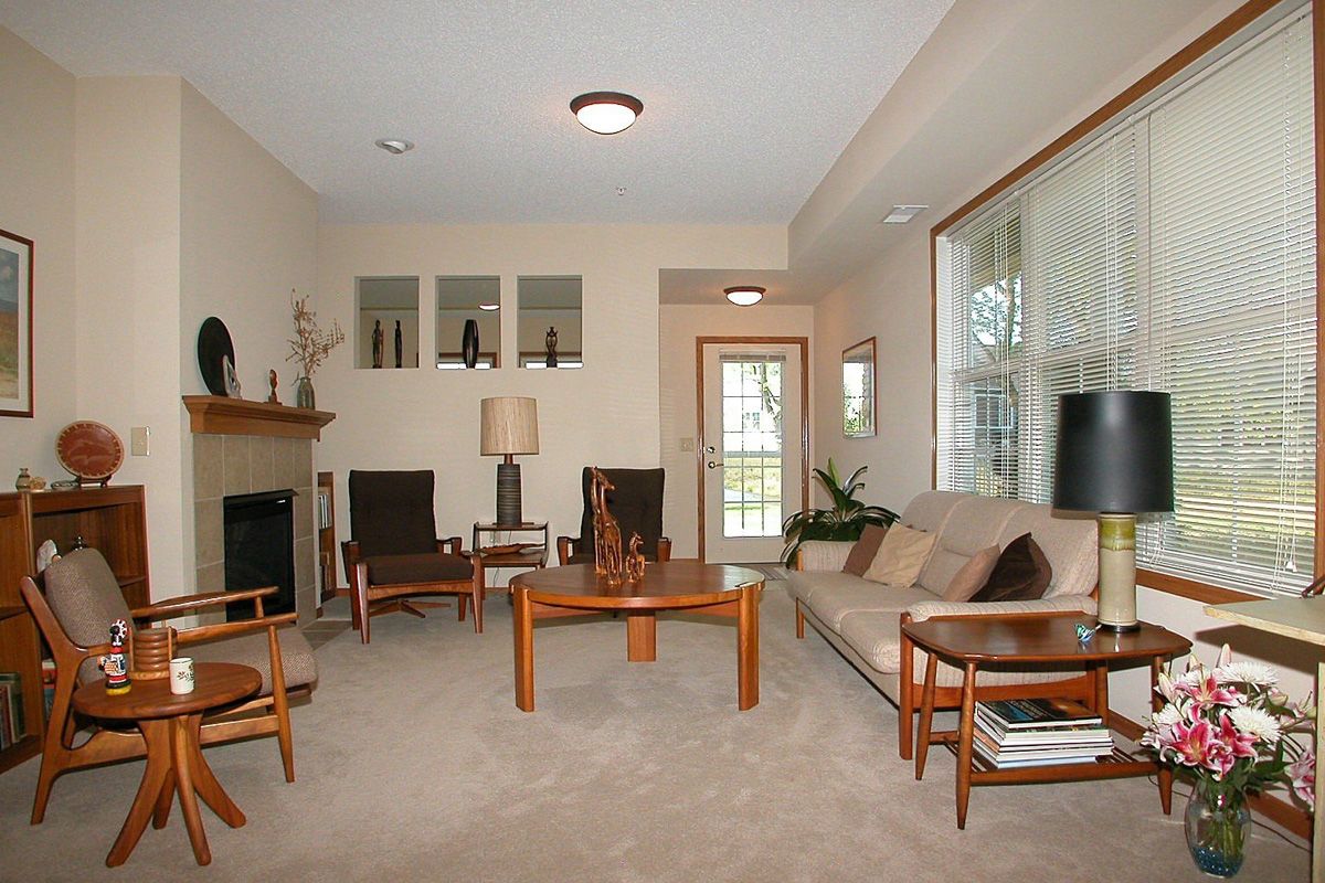 A modern living room featuring neutral tones and sleek furniture.