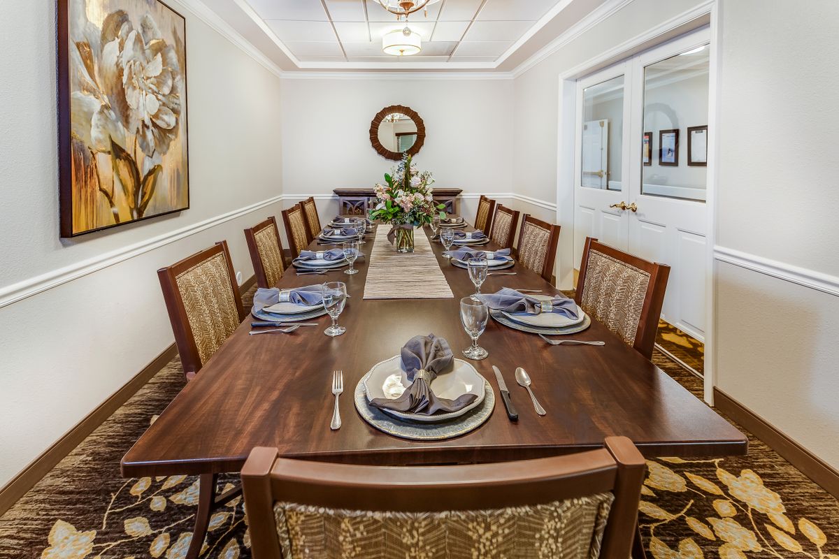 Elegant dining room with a fully set table and stylish decor.