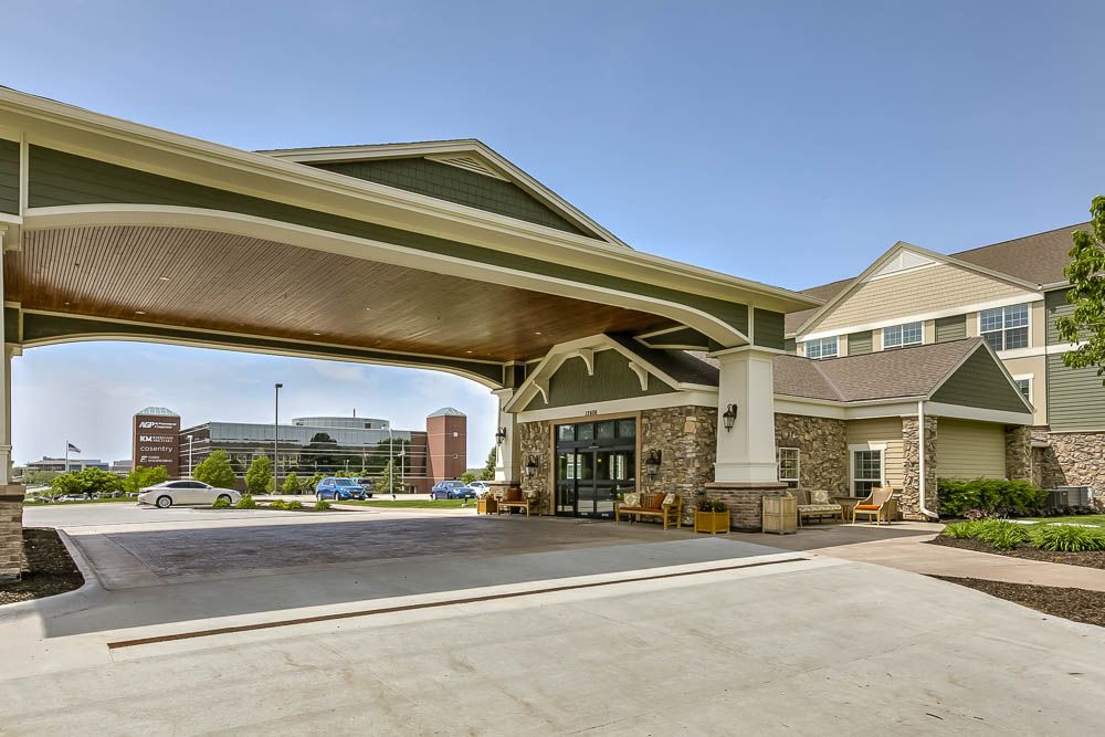 Modern hotel entrance with a covered driveway.