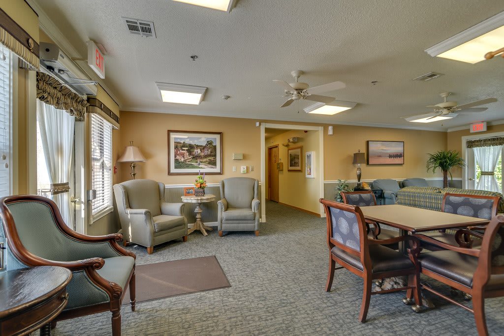 A cozy living room with comfortable seating and warm lighting.