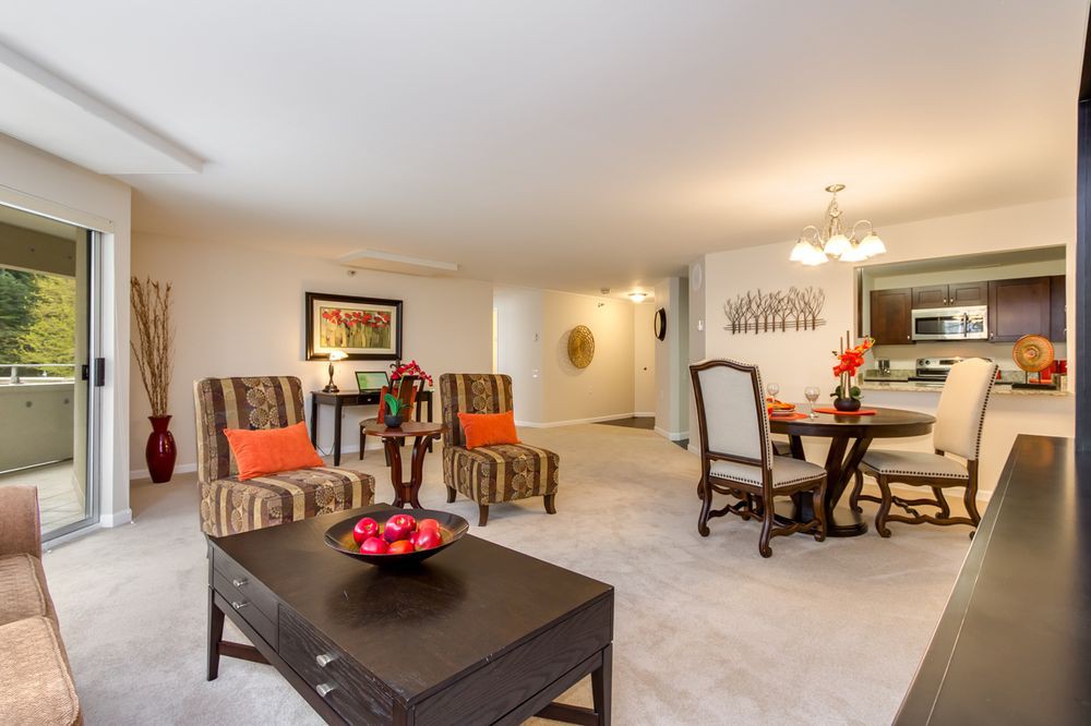 A spacious living and dining area with elegant furnishings and decor.