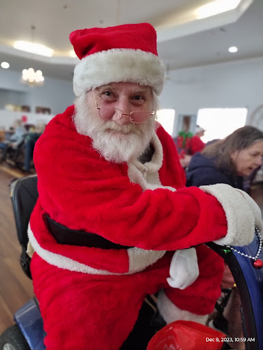 A joyful Santa Claus enjoying a festive gathering.