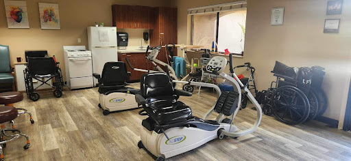 A well-equipped gym area featuring advanced exercise machines for fitness and rehabilitation.