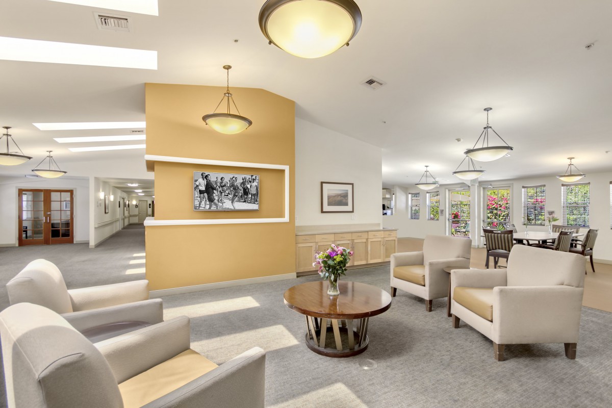 A spacious lobby area featuring comfortable seating and modern lighting.