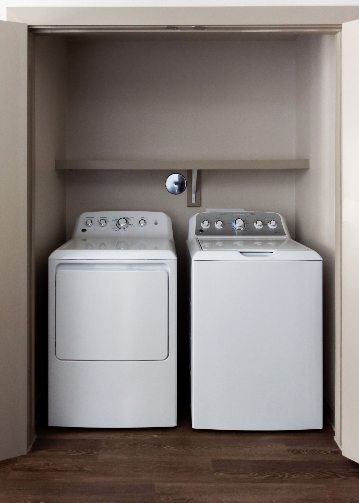 A compact laundry space featuring a washing machine and dryer side by side.