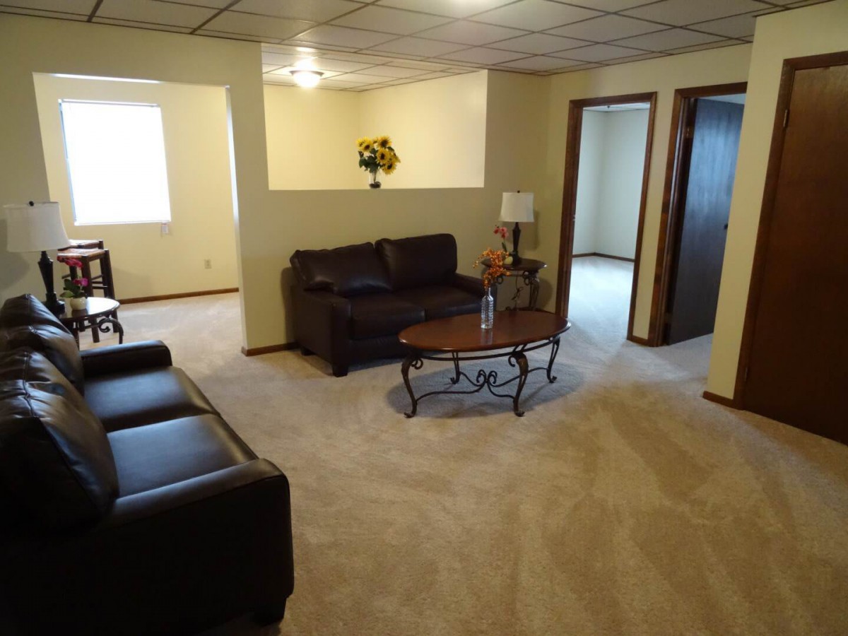 A cozy living room with comfortable seating and a coffee table.