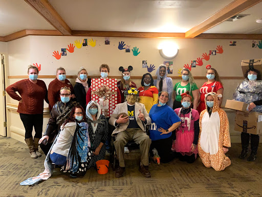 A festive gathering showcasing creative costumes in a Halloween celebration.