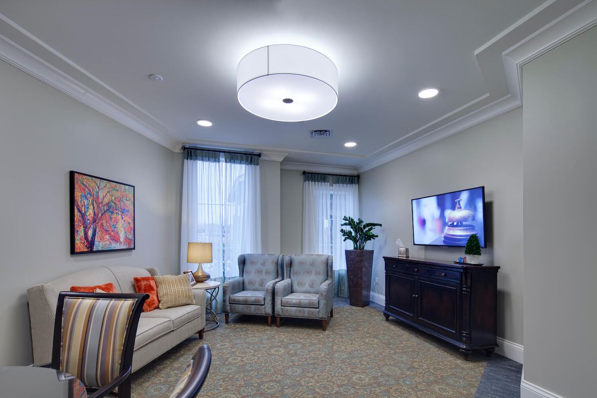 A modern and cozy living room with stylish furniture and contemporary lighting.