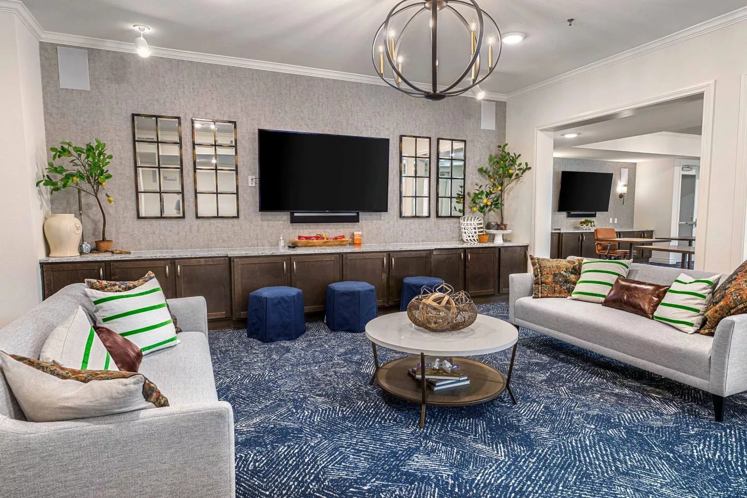 A modern living room with stylish decor and comfortable seating.