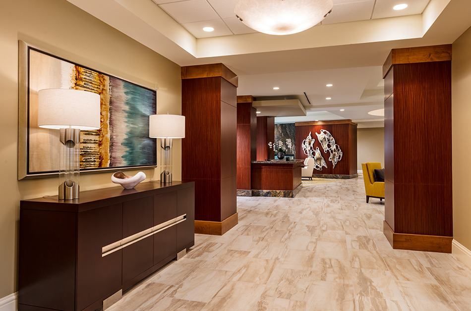 A modern hotel lobby with elegant decor and contemporary artwork.