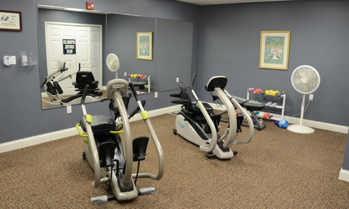 A small gym with stationary bikes and fitness equipment.