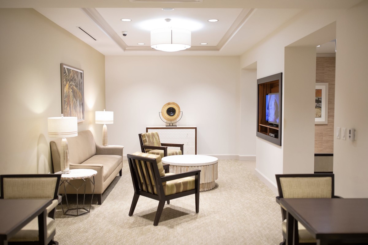 A modern living room with stylish furniture and elegant lighting.