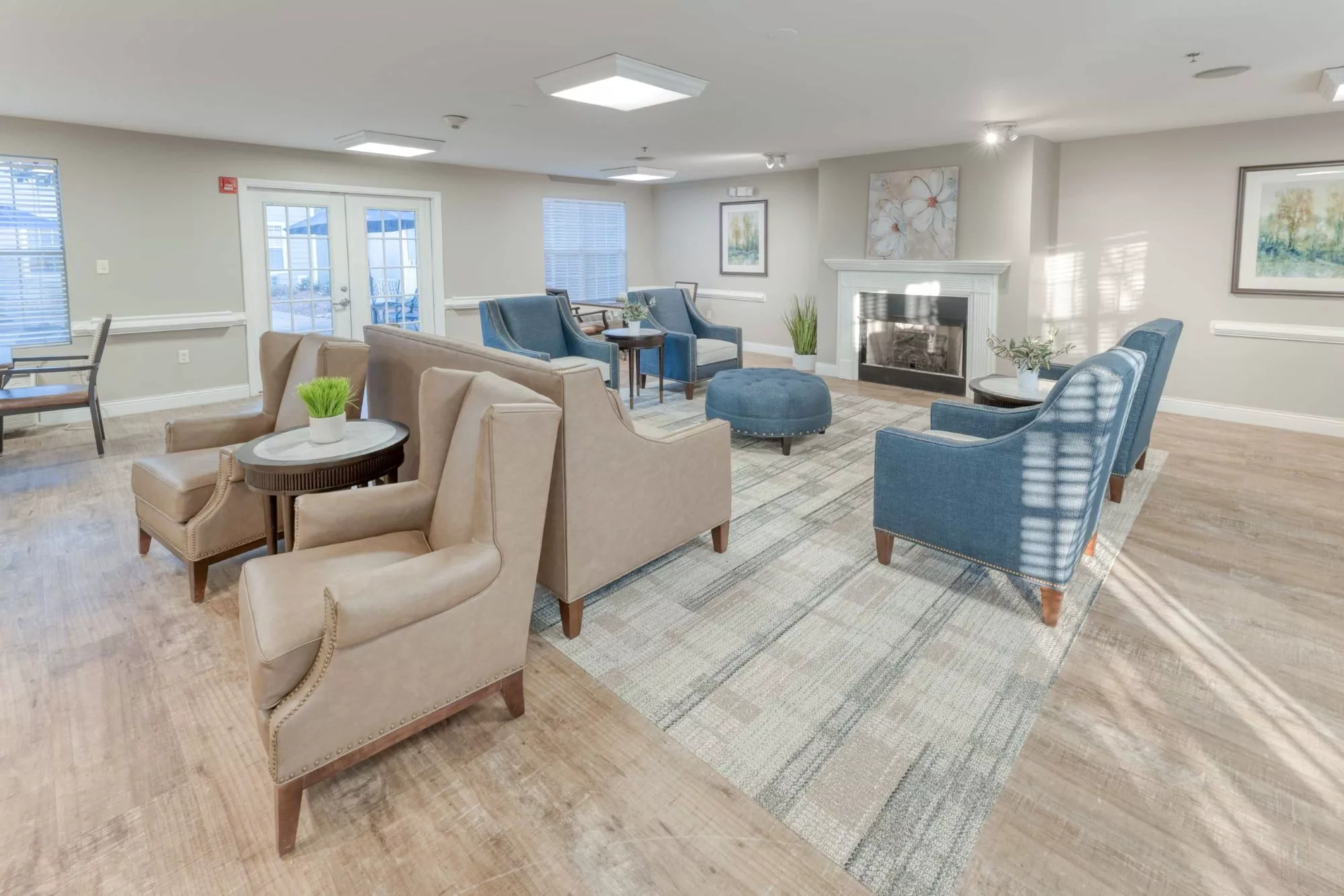 A modern living room with comfortable seating and a fireplace.
