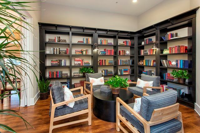 Cozy reading nook with bookshelves and comfortable seating.