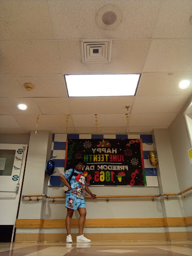 A vibrant dance studio celebrating 'National Dance Day' with colorful decorations and joyful energy.
