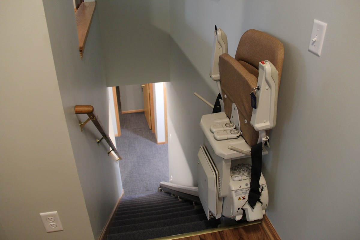 An indoor stairlift installed on a staircase for enhanced accessibility.