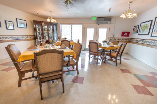 A spacious and well-lit dining area, designed for comfort and social gatherings.