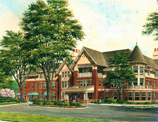 A beautifully detailed historic hotel building surrounded by lush greenery.
