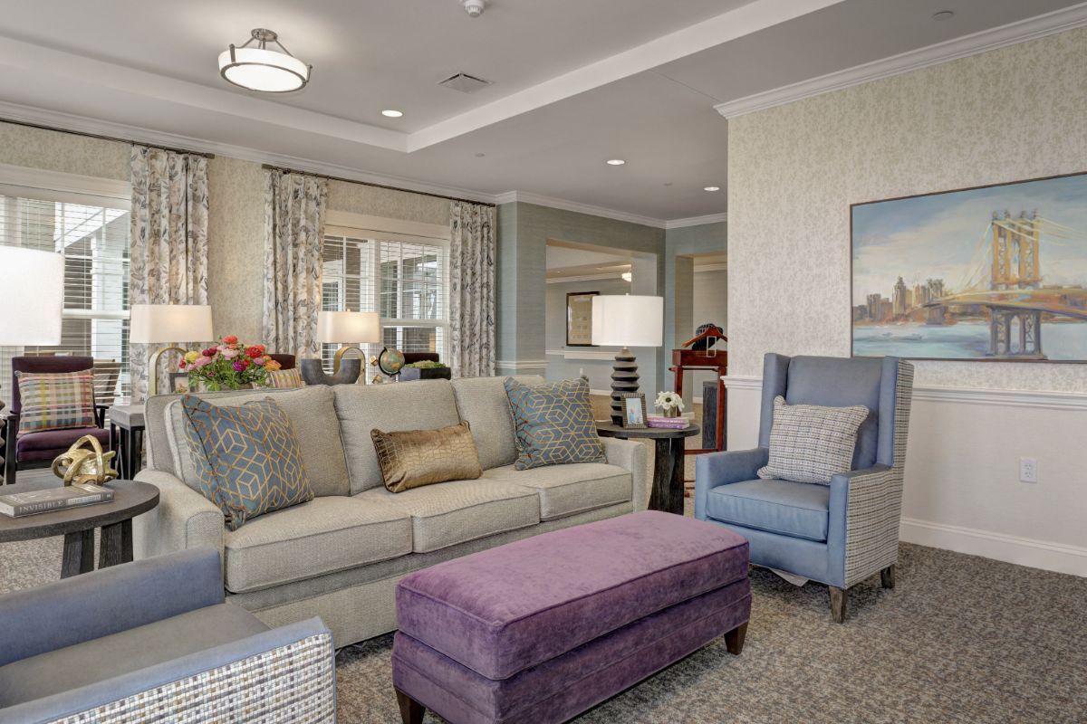 A modern living room with a comfortable sofa, armchairs, and stylish decor.