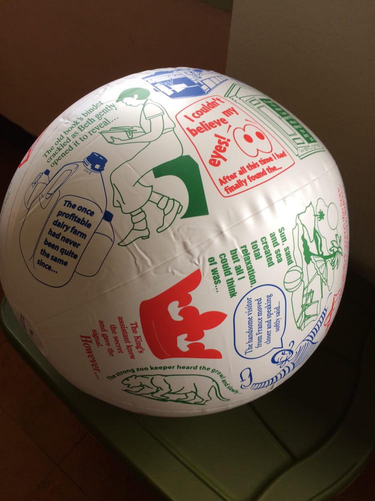 A beach ball displaying colorful exercise instructions and illustrations.