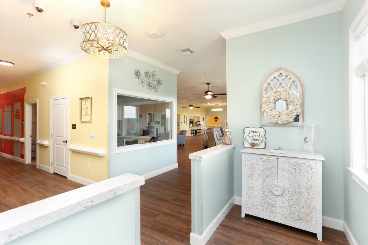 A modern and elegantly decorated living area with light pastel walls and stylish furnishings.
