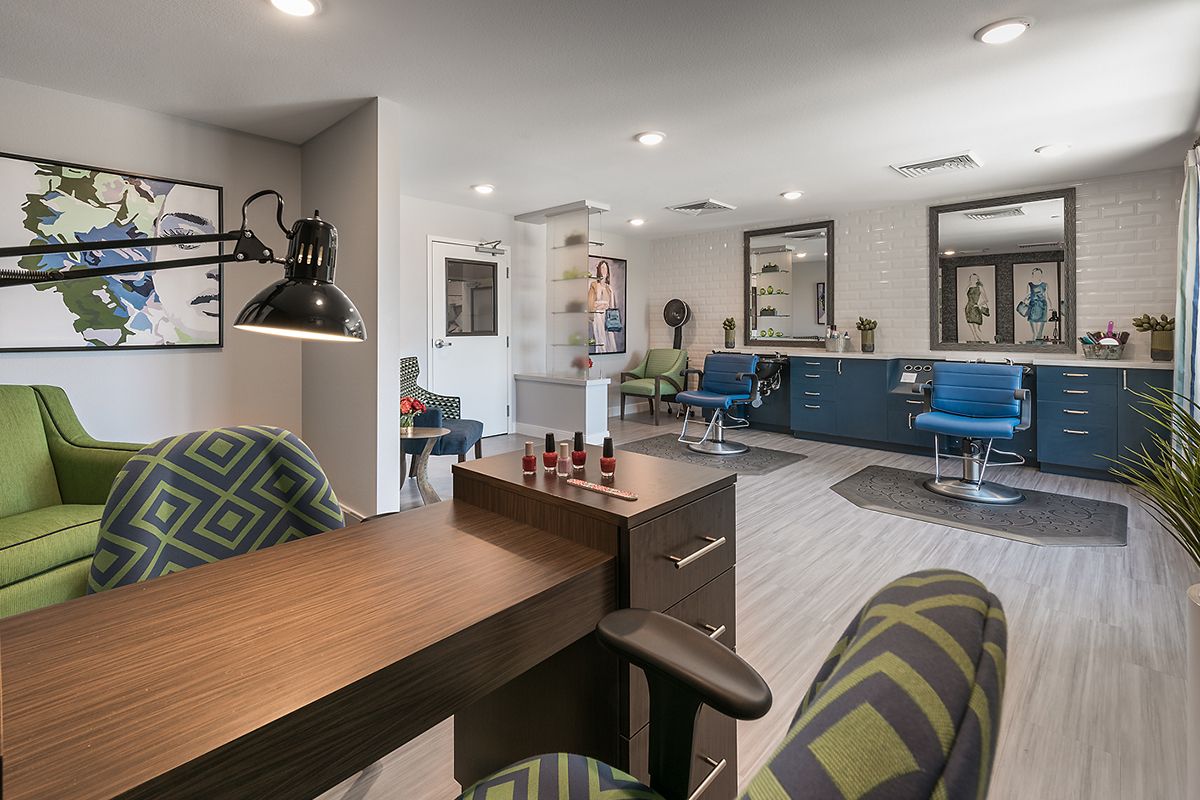 A modern salon interior with stylish furniture and bright lighting.