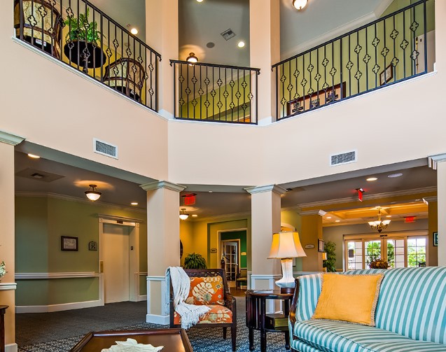A spacious and elegantly decorated lobby with comfortable seating and ambient lighting.