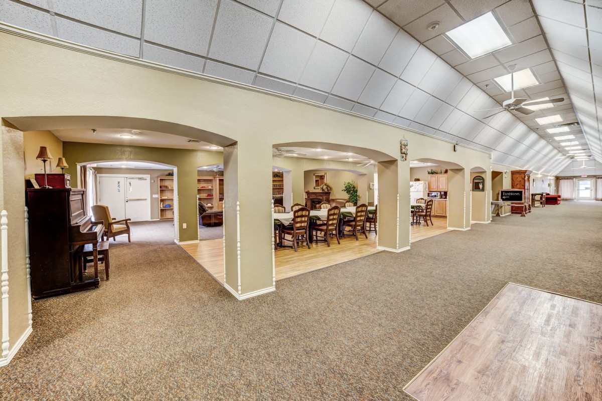 A modern library interior with bookshelves and seating areas.