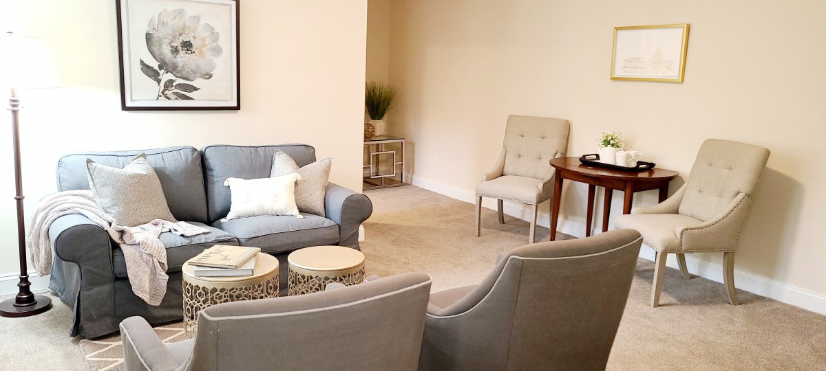 A cozy living room with comfortable seating and minimalist decor.