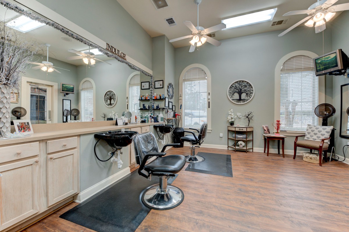 A well-organized hair salon interior with chairs and styling stations.