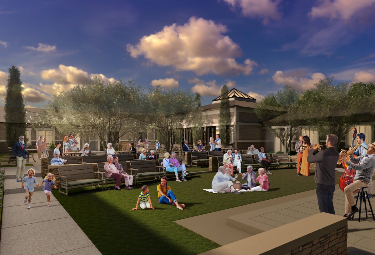 A group of people enjoying a relaxing evening at a park, socializing and spending time together.
