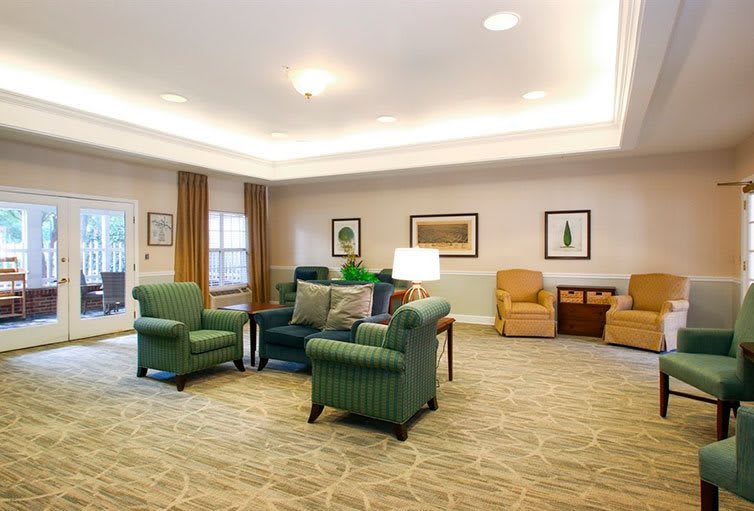 A cozy living room with comfortable seating and warm lighting.