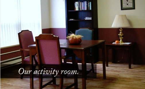 A cozy activity room with a table and chairs, perfect for gatherings.