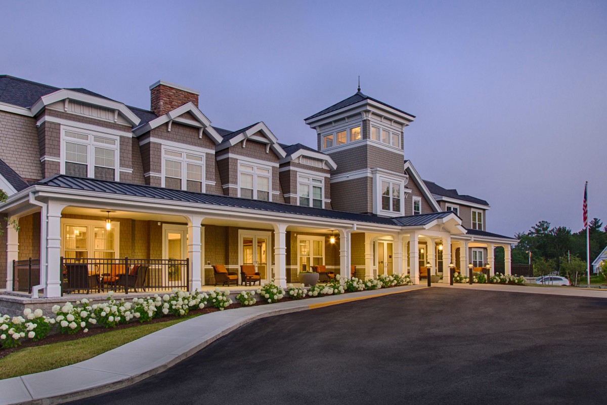 A beautifully lit hotel building at dusk, showcasing its elegant architecture.