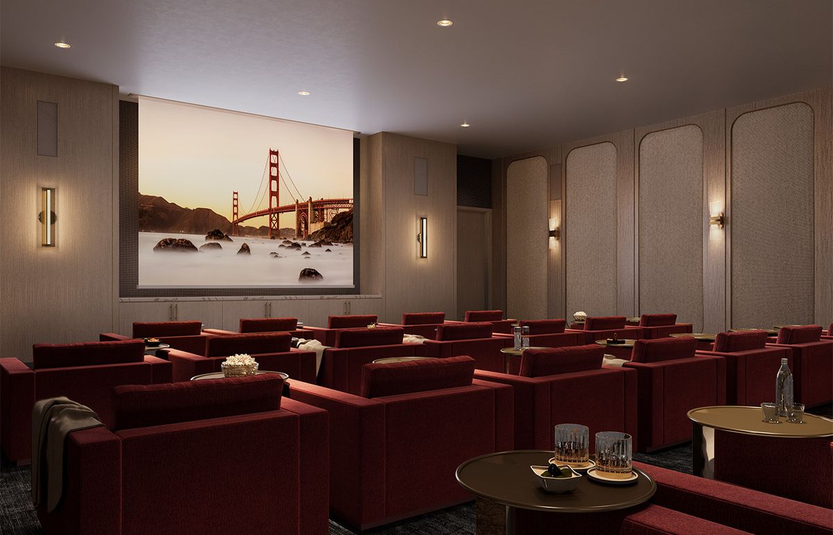 A luxurious home theater with comfortable seating and a large screen.