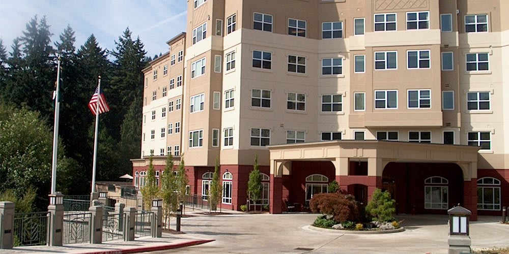 A multi-story residential apartment building with a modern design.