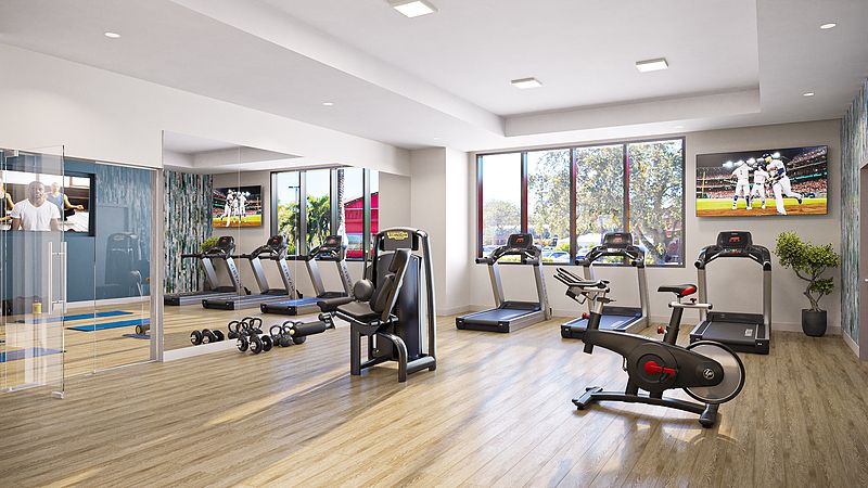 A well-equipped gym with treadmills, weights, and various exercise machines.