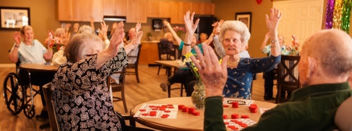 A joyful group of seniors participating in a lively activity together.