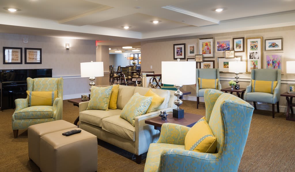 A cozy and well-furnished living room with comfortable seating and warm lighting.