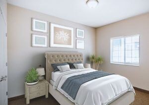 A modern bedroom with elegant decor and soft lighting.