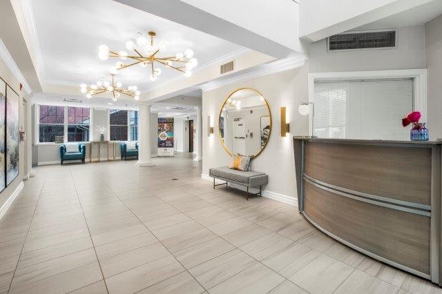 A modern hotel lobby with chic lighting and a stylish reception area.