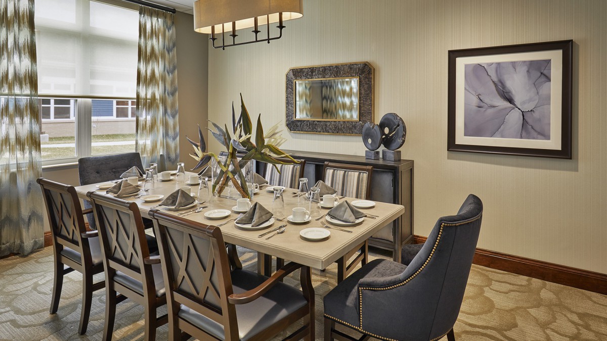 Elegant dining room with a beautifully set table and modern decor.