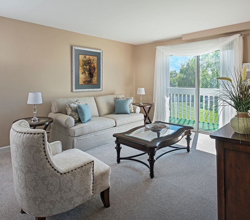 A cozy living room with comfortable seating and ample natural light.