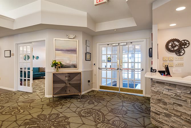 A modern lobby area with stylish decor and bright lighting.